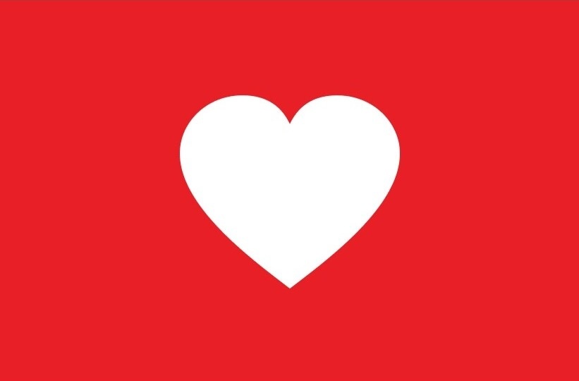 Logo Purina are grijă de comunitate cu o inimă albă pe fundal roșu